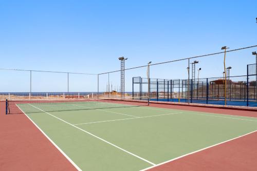 a tennis court with a net on top of it at Pickalbatros Vita Resort - Portofino Marsa Alam in Abu Dabab
