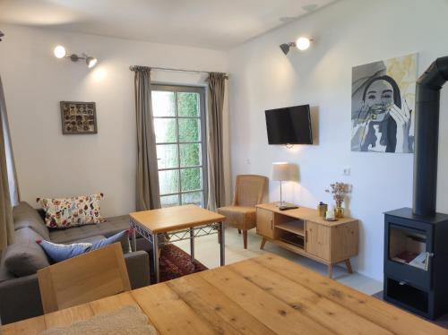 a living room with a couch and a table at Ferienhaus am Himberg in Straden