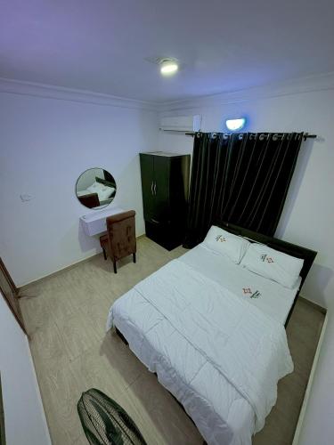 Postel nebo postele na pokoji v ubytování A4 Service Apartment & Suite