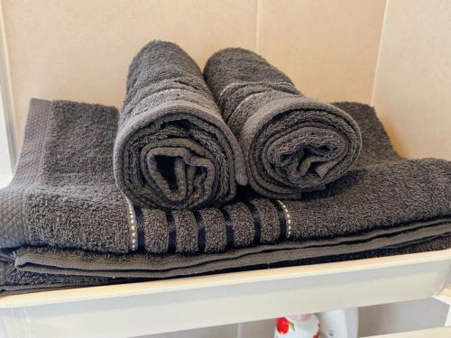 a pile of towels sitting on a shelf at One bedroom apartment 702 in Pattaya city center in Pattaya North