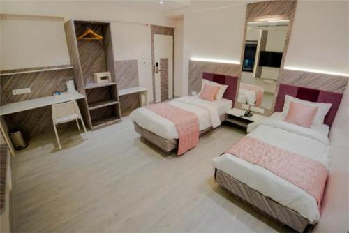 Ένα ή περισσότερα κρεβάτια σε δωμάτιο στο Hotel Pritam, Nagpur