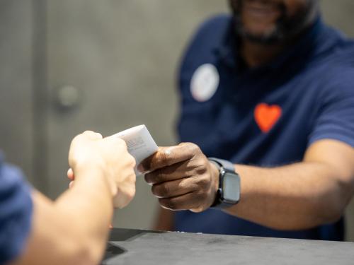 a man holding a cell phone in his hands at ibis Paris Alesia Montparnasse in Paris