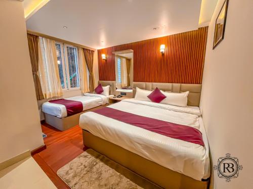 Giường trong phòng chung tại Norgyunma, Hotel and Restaurant