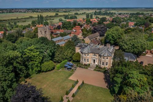 an aerial view of a large house in a city at Washingborough Hall Hotel in Lincoln