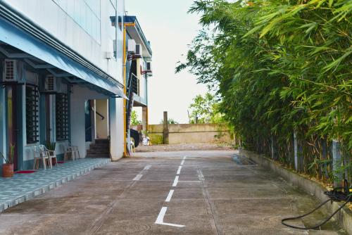 an empty street in front of a building at Point Vista Transient Accomodation in Daet