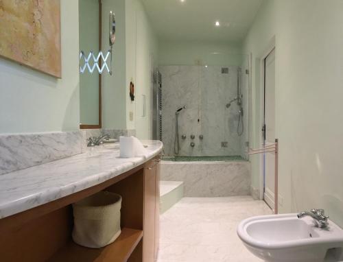 a bathroom with a sink and a toilet and a shower at Poggio Rozzi in Tavarnelle in Val di Pesa