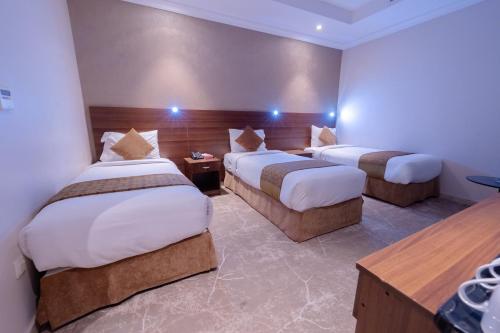 Postel nebo postele na pokoji v ubytování فندق ملتقى الايمان 2 Multaqa Aleiman hotel