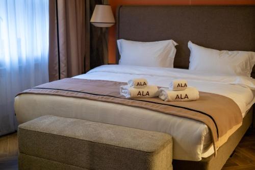Postel nebo postele na pokoji v ubytování Ala Boutique Hotel