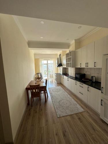 a kitchen with a table and a dining room at CenterApart in Bishkek
