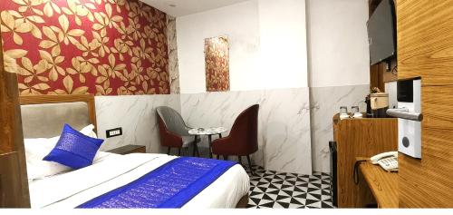 Una cama o camas en una habitación de The Yuvaan Family hotel New Delhi Railway Station