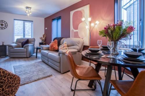 a living room with a couch and a table at Wiston Street - 2 Bedroom Holiday Home - Pembroke in Pembroke