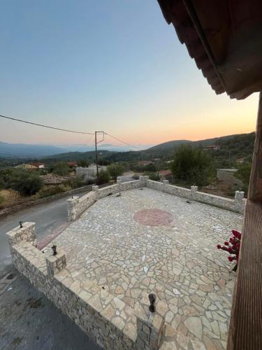 a large stone patio with a view of a road at The stone Mansion of 1887 