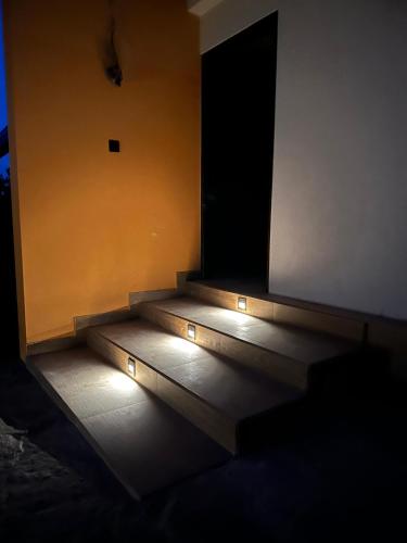 a set of stairs in a room with lights at Lake Breeze Cabana Yala in Tissamaharama