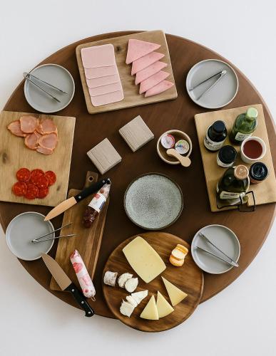 a table with different types of cheese and meats at Málaga Sierra de las Nieves by Real Spain Hotels Adults Recommended in Casarabonela