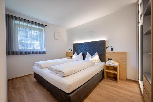 Ένα ή περισσότερα κρεβάτια σε δωμάτιο στο Apartments Raffl