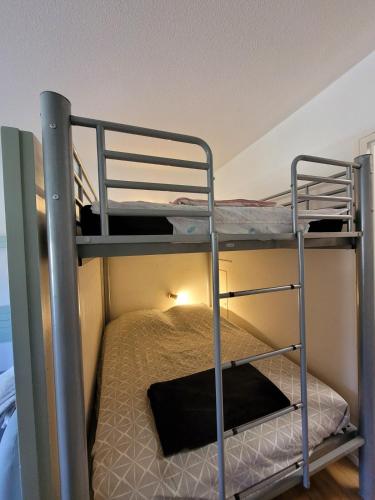 a couple of bunk beds in a room at appartement superdevoluy in Le Dévoluy