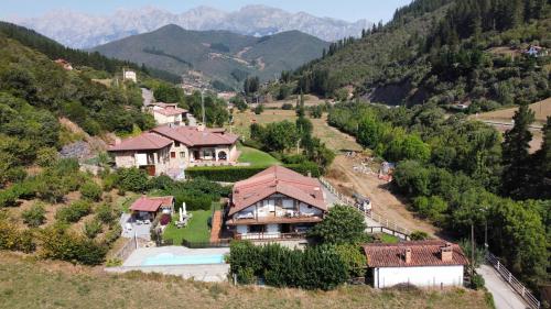 an aerial view of a house on a mountain at Apartamento Valverde II in Potes
