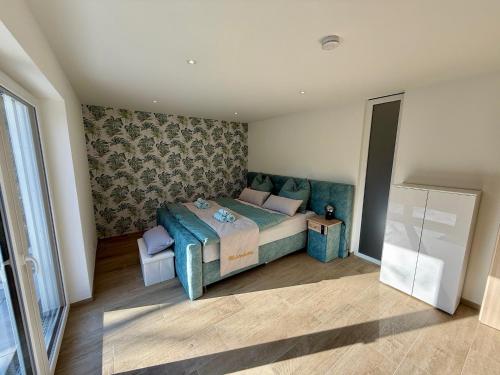 Ένα ή περισσότερα κρεβάτια σε δωμάτιο στο Residenz Donau-Schlossblick