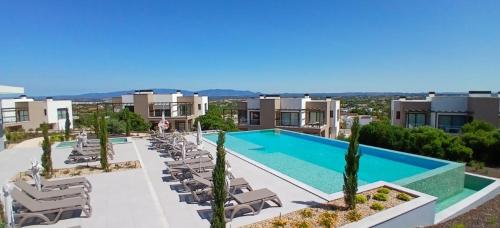 a view of the pool at a villa with a resort at Pestana Valley in Estômbar