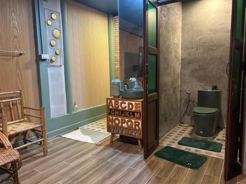 a bathroom with a sink and a toilet at The oasis on 8 Tropical 2 