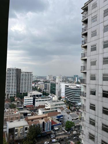 a view of a city with a tall building at instaspace in Bandung