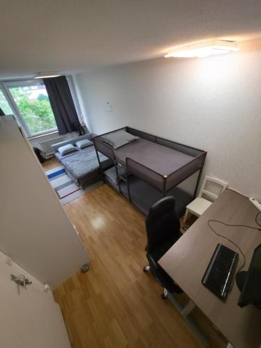 an overhead view of an office with a desk and a bed at Room for 4 People with Garden View in Kirchheim