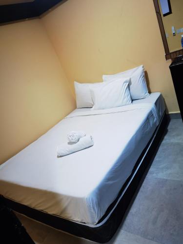 Ένα ή περισσότερα κρεβάτια σε δωμάτιο στο Moonlight Inn Bukit Bintang