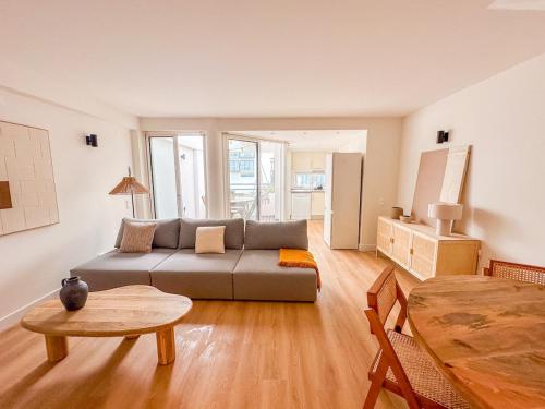 a living room with a couch and a table at Resort house with Pools and Private beach in Tavira
