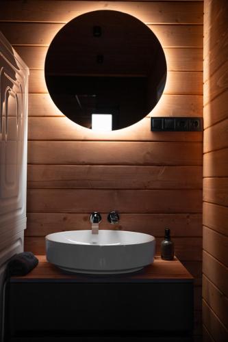 a bathroom with a white sink and a mirror at Shepit space in Slavske