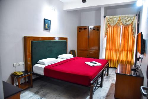 Ένα ή περισσότερα κρεβάτια σε δωμάτιο στο Hotel Grand Palace