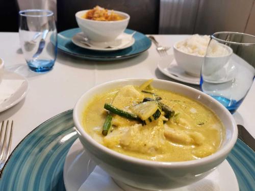 a bowl of soup on a plate on a table at The Old Bell - Warminster in Warminster