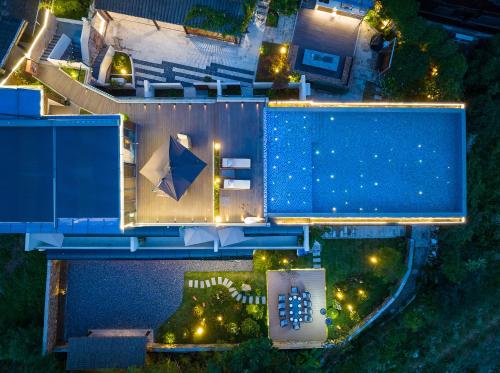 an overhead view of a building at night at Hilltop House Resort in Zhangjiajie