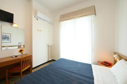 Ένα ή περισσότερα κρεβάτια σε δωμάτιο στο Hotel Mayola Mhotelsgroup