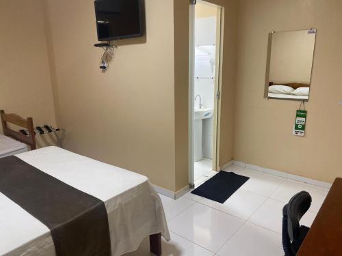 Postel nebo postele na pokoji v ubytování Belo Hotel