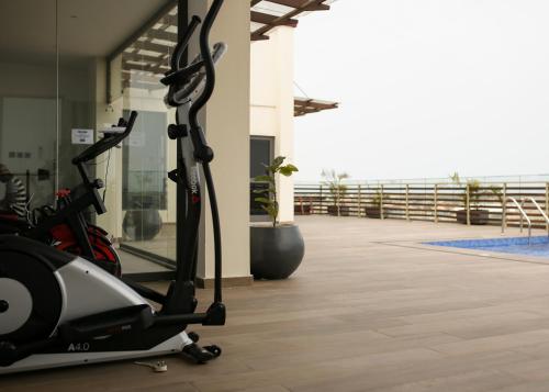 a gym with a treadmill in a building at Akwaaba Retreats in Tema