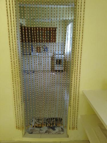a mirror on a wall in a room at Sunflower Inn in Kingstown
