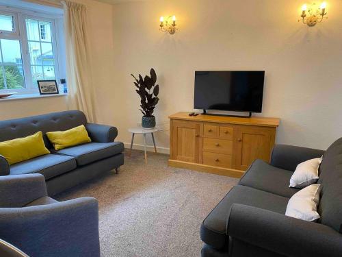 Ein Sitzbereich in der Unterkunft Stable Cottages 1&2 beside Canal & Surfing Beaches