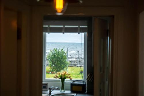 a view of the ocean from a kitchen window at 5 South Street in Arbroath