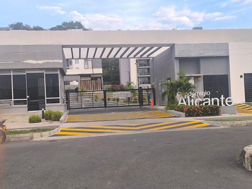 a building with a sign on the side of a street at Apartamento Alicante in Girardot