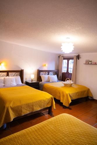 Postel nebo postele na pokoji v ubytování Hotel Casa Linda