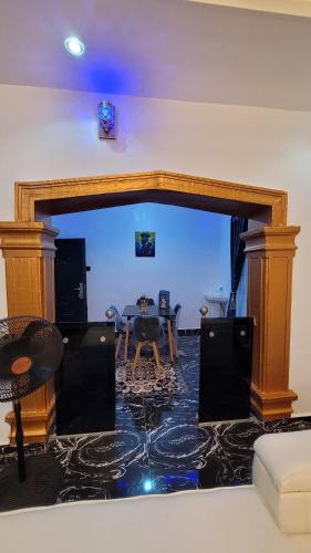 a living room with a table and a couch at Treasure Home 