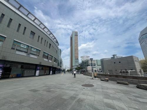 a person walking down a street in a city at Konyamachi2F しげの里 in Takamatsu