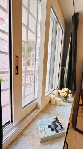 a book sitting on the floor next to a window at Casa MAR e LUNA in Amalfi