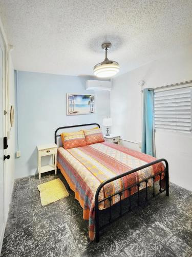 a bedroom with a bed in a room at Kokomo Hotel in Culebra