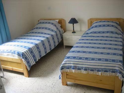two beds sitting next to each other in a bedroom at Penthouse Apartment Latchi Cyprus in Lachi