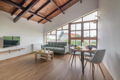 a living room with a couch and a table at Infinity Coast by Fidalsa in Miengo