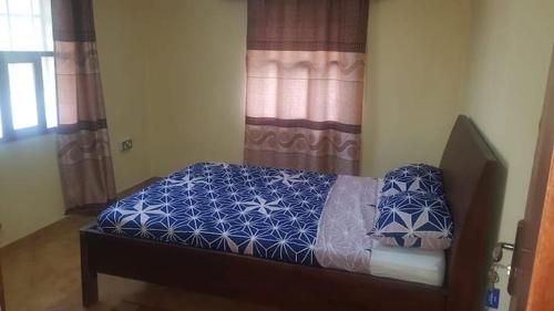 Ένα ή περισσότερα κρεβάτια σε δωμάτιο στο Rosaline's Lodge