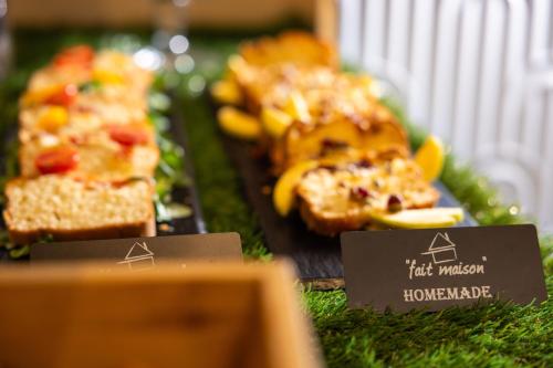 a display of food items on a table with signs at Hôtel Byakko Nice in Nice