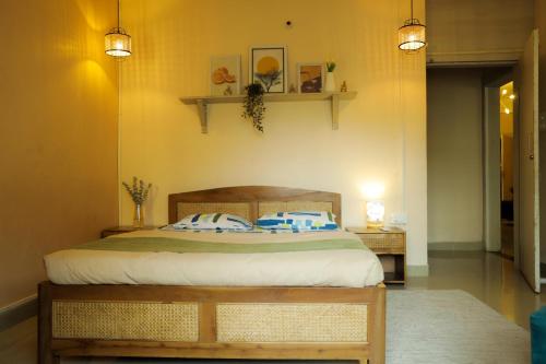 a bedroom with a bed with two pillows on it at The aura 3bhk near Paltan Bazar in Guwahati