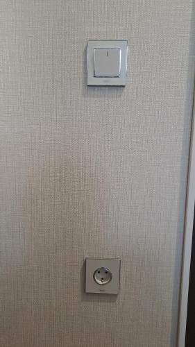 a metal wall with a button on it at Xaldan hotel in Baku